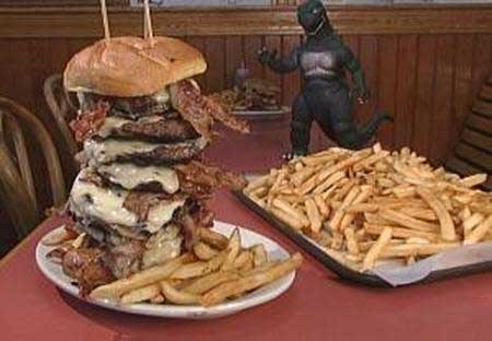 fat man eating burger. okay to eat a seven-pound